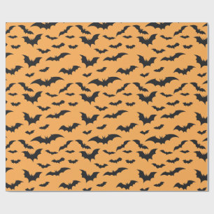 Halloween bats on orange background wrapping paper