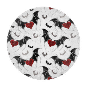 Halloween heart with black bat wings cutting board