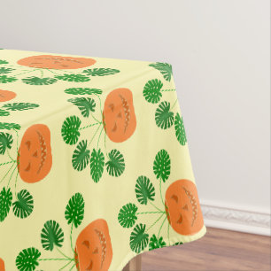 Halloween Monstera Plant in Pumpkin Patterned Tablecloth