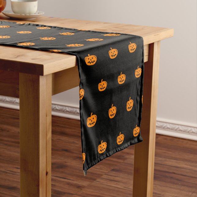 Halloween party table runner with pumpkin heads (In Situ)