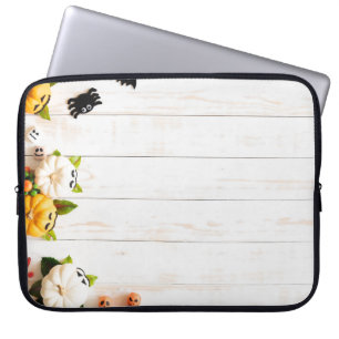 Halloween pumpkins, bats, spider top view. laptop sleeve