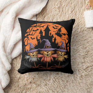 Halloween scarecrow trio beneath an eerie moon cushion