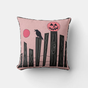 Halloween scene with fence, crow, full moon, & pum cushion
