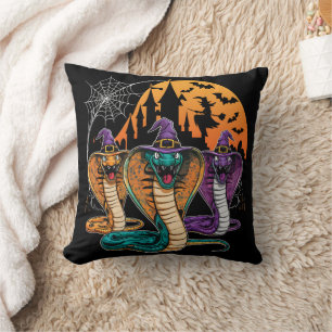 Halloween snakes in vibrant costumes at night cushion