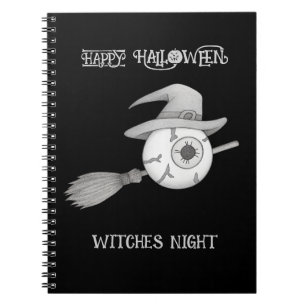 Halloween witch broom and scary eyeball notebook