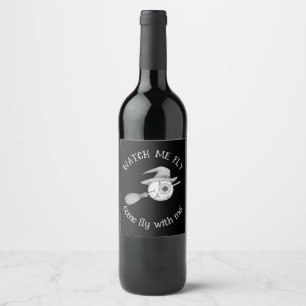 Halloween witch broom and scary eyeball wine label