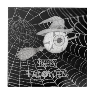 Halloween witch broom, scary eyeball, spider web tile