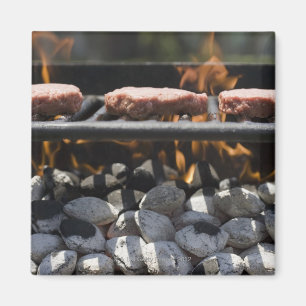 Hamburgers cooking on grill magnet