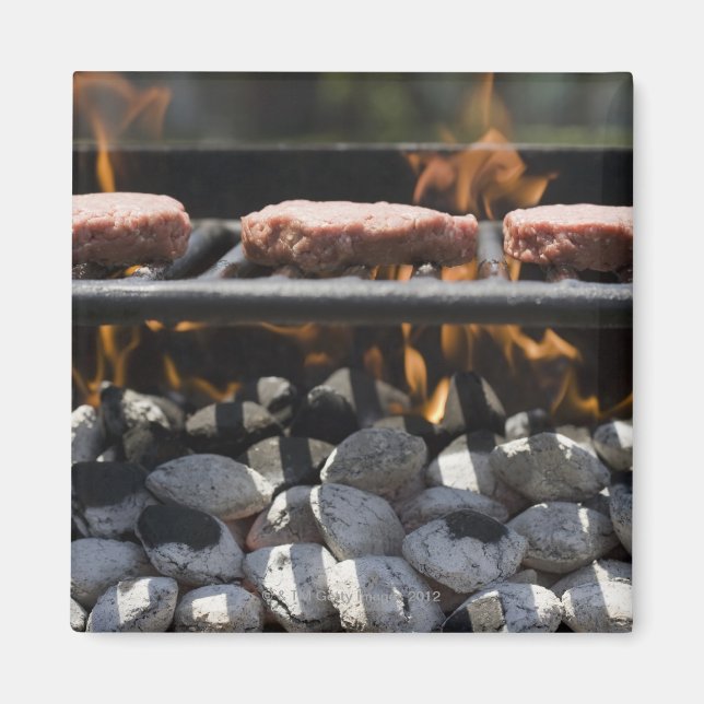 Hamburgers cooking on grill magnet (Front)