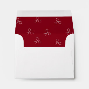 Hand drawn scissors on maroon red envelope