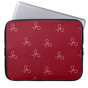 Hand drawn scissors on maroon red laptop sleeve