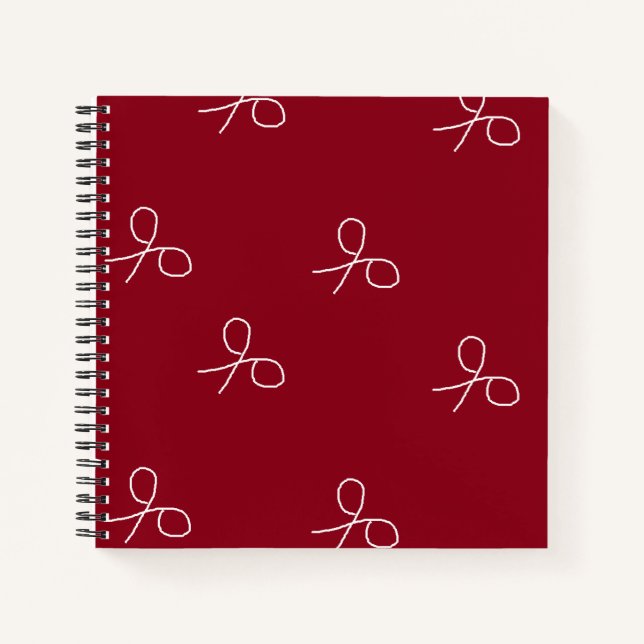 Hand drawn scissors on maroon red notebook (Front)