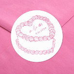 Hand Drawn Vintage Cake Whimsical Pink Wedding Classic Round Sticker<br><div class="desc">Personalised Vintage Cake Wedding Monogram Stickers. These custom round wedding stickers feature a simple vintage-style cake illustration at the centre, topped with the couple’s monogram initials and wedding date for a timeless and elegant touch. The minimalist design uses a mix of handwritten and script fonts in cute baby pink, keeping...</div>