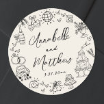 Hand Drawn Vintage Whimsical Wedding Classic Round Sticker<br><div class="desc">Personalized Hand-Drawn Quirky Wedding Stickers. These fun and playful round wedding stickers feature quirky doodle illustrations surrounding the edges, all in bold black against a soft off-white ivory background, giving them a rustic, vintage, or gently aged look. Elements like a champagne tower, wedding cake, disco ball, hearts, wedding bells, rings,...</div>