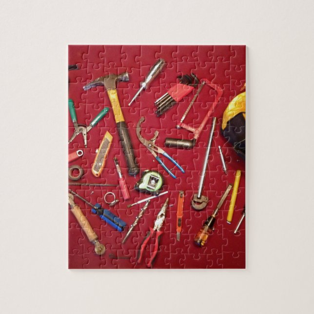 Hand held tools and tool bag red background jigsaw puzzle (Vertical)