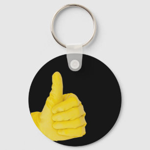 Hand in yellow latex glove key ring