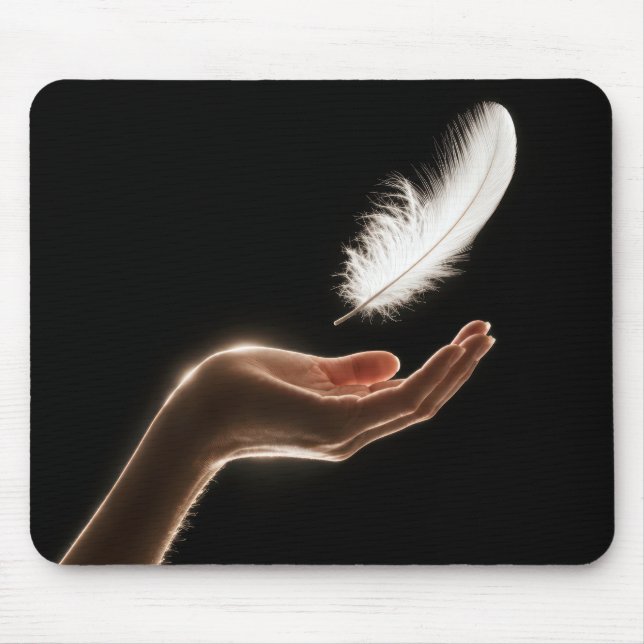 Hand Releasing a White Feather Mouse Mat (Front)