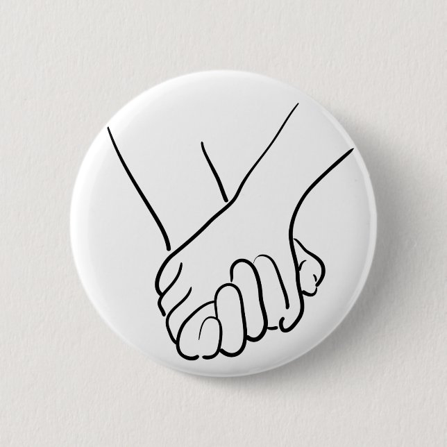 hands holding 6 cm round badge (Front)