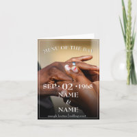 Hands of a coloured wedding couple pin on ring