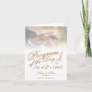 Hands of a coloured wedding couple pin on ring gol card