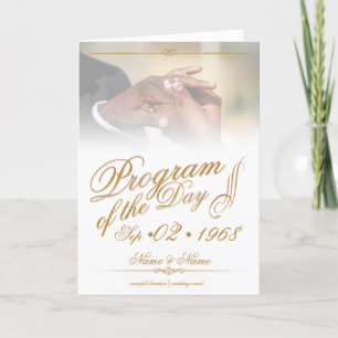 Hands of a coloured wedding couple pin on ring gol holiday card