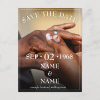 Hands of a coloured wedding couple pin on ring hol