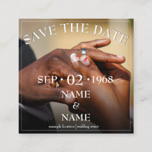 Hands of a wedding couple with ring enclosure card