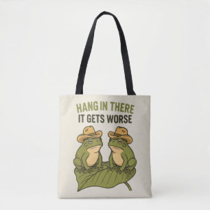 Hang in there it gets worse funny frog tote bag