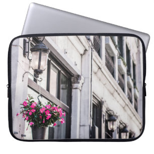 HANG PINK FLOWER ON WHITE CONCRETE BUILDING AT DAY LAPTOP SLEEVE