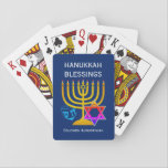 HANUKKAH BLESSINGS  PLAYING CARDS<br><div class="desc">Modern, stylish HANUKKAH BLESSINGS playing cards, designed with large menorah (hanukkiyah) at the centre, and blue dreidel and colourful Star of David on either side. Text reads HANUKKAH BLESSINGS with a placeholder name at the bottom. Both of these are CUSTOMIZABLE so you can personalise with your own greeting or heading,...</div>