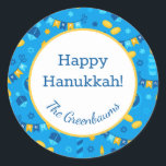 Hanukkah Dreidels Gift Tag<br><div class="desc">These fabulous gift tags would look great on all your Hanukkah gifts.  They are so festive with their menorahs,  gelt,  Hanukkah candles and banners and Stars of David in blue and yellow.  Trendy yet traditional.  And,  they are customisable with your family name.</div>