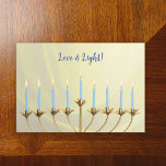 Hanukkah Gold Menorah and Candles "Love and Light" Holiday Card<br><div class="desc">Send warm wishes and celebrate the joyous festival of Hanukkah with our exquisite greeting card featuring a vibrant gold menorah. The work captures the essence of the festival,  symbolising the triumph of light over darkness.</div>
