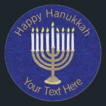Hanukkah Gold Menorah On Rich Blue Background Classic Round Sticker<br><div class="desc">A classic Hanukiah design in gold and white on a deep blue faux sparkle background features space for your personalised text making this round sticker a unique addition to your Hanukkah celebrations. Use these Hanukkah stickers on mailings, scatter on a gift package or tuck them into favour bags as party...</div>