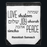Hanukkah Sameach Drawstring Bag<br><div class="desc">Stylish HANUKKAH SAMEACH Drawstring Bag with LOVE JOY PEACE including Hebrew translations in black typography against a WHITE background. Text is CUSTOMIZABLE, in case you wish to change anything. HAPPY HANUKKAH is also customisable, so you can replace with a name or initials. Part of the HANUKKAH Collection. Matching items are...</div>