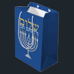 Hanukkah Shalom Peace on Earth Blue Medium Gift Bag<br><div class="desc">Hanukkah Shalom Peace on Earth Blue Gift Bag for all your holiday treats. Festive Hanukkah blue with a silver menorah and gold Shalom Peace On Earth. Easy to customise with text, fonts, and colours. Created by Zazzle pro designer BK Thompson exclusively for Kate’s Creations; please contact us if you need...</div>