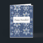 Hanukkah Starflakes Greeting Card<br><div class="desc">This design shows a pattern made from snowflakes in the shape of Stars of David. The larger ones include Hanukkah motifs like dreidels, Hanukkah lamps, and candles. The snowflake designs integrate Hanukkah motifs into six-pointed snowflake shapes, set against a nighttime sky with smaller snowflakes and falling snow. The pattern represents...</div>
