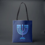 Hanukkiah Happy Hanukkah Jewish Holiday Menorah Tote Bag<br><div class="desc">Hanukkiah Symbol. Happy Hanukkah Party Jewish Holiday Blue Menorah. Jewish Holiday Chanukkah Decoration with traditional Chanuka decorative symbol - Navy Blue colour hanukkiah menorah, candlestick with candles, star of David and neon blue glowing lights illustration. Hanukkah Festival of lights Event Decoration. Jerusalem, Israel. Accessories > Bags & Wallets > Totes...</div>