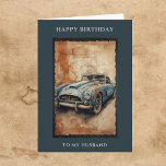 Happy Birthday Husband Vintage Car Greeting Card<br><div class="desc">Happy Birthday card for him. Happy Birthday To My Husband greeting above and below a watercolor illustration of a classic vintage car, retro model painted in a weathered blue colour, set against a textured background resembling aged parchment with cracks and warm tones. The composition gives a nostalgic and artistic feel,...</div>