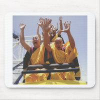 Happy buddhist monks on a roller coaster