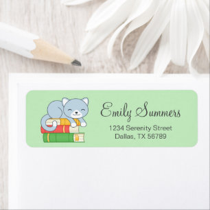 Happy Cat on top of a Book Stack on Green