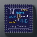 HAPPY CHANUKAH Love Joy Peace HEBREW Personalised Plaque<br><div class="desc">This is a colourful festive desktop plaque with faux silver Star of David in a subtle pattern against a deep blue background. The words LOVE JOY PEACE including their Hebrew translations are colour-coded. The text is customisable in case you wish to change anything. HAPPY CHANUKAH is written in faux silver...</div>