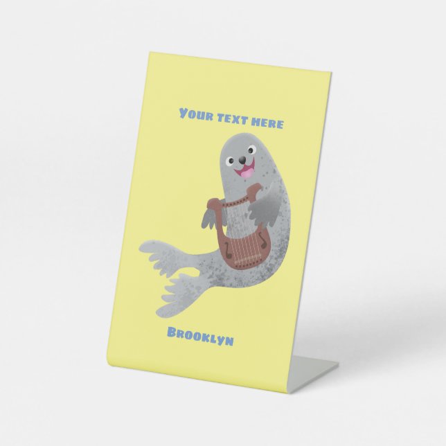 Happy cute harp seal cartoon illustration pedestal sign (Front)