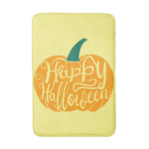 Happy Halloween lettering on carved pumpkin Bath Mat