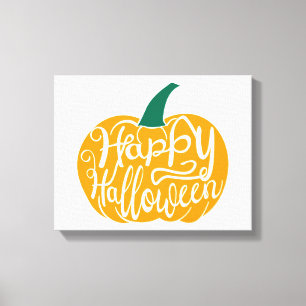 Happy Halloween lettering on carved pumpkin Canvas Print