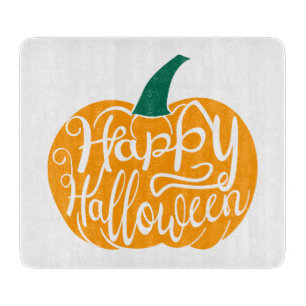 Happy Halloween lettering on carved pumpkin Cutting Board
