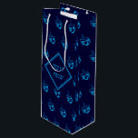 HAPPY HANUKKAH חנוכה שמח Hebrew Dreidel NAVY CYAN Wine Gift Bag<br><div class="desc">This stylish midnight blue WINE gift bag with all over cyan dreidel print would make an excellent choice for presenting your bottle gifts during Hanukkah. The front says חנוכה שמח (Happy Hanukkah) and the back shows customisable placeholder text. Matching gifts and home decor ideas are available in the HANUKKAH Collection...</div>