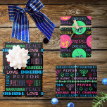 Happy Hanukkah Colourful Childs Name Typography Wrapping Paper Sheet<br><div class="desc">Add your child's name to this cute and colourful Happy Hanukkah typography wrapping paper for a personalised touch to your Festival of Lights. Sheet One features a mix of fun fonts in bright shades of blue, purple, green, pink and red on a black background. Nestled in among DREIDEL, HANUKKAH, CHANUKAH...</div>