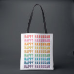 Happy Hanukkah | Simple Rainbow Colours Typography Tote Bag<br><div class="desc">Celebrate the festive season with this vibrant "Happy Hanukkah" tote bag! Featuring the cheerful phrase repeated in a rainbow of colours, this design brings joy and warmth to your Hanukkah celebrations. Ideal for carrying gifts, groceries, or holiday essentials, this bag is both stylish and practical. It’s a thoughtful gift for...</div>