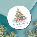 Happy Holidays Beach Christmas Tree Classic Round Sticker<br><div class="desc">Happy Holidays Beach Christmas Tree Classic Round Sticker. Spread some coastal cheer with this festive round sticker featuring a beach-inspired Christmas tree made of seashells and a starfish topper. Perfect for sending beachy holiday wishes, this sticker is ideal for anyone living in tropical places like Hawaii or those who love...</div>