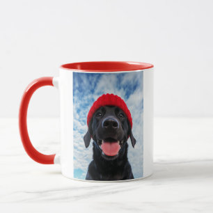 Happy Labrador in a Red Beanie Under a Blue Sky Mug